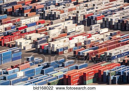 Stock Image - Aerial view of containers in urban shipyard. Fotosearch