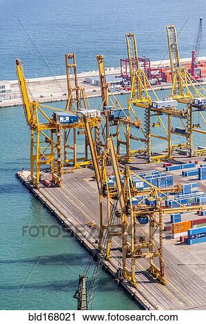 Aerial view of cranes and containers in urban shipyard View Large Photo Image Stock Image - Aerial view of cranes and containers in urban shipyard. Fotosearch