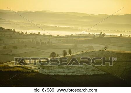 Stock Photograph - Aerial view of fog in rural farmland, Mandalay, Myanmar. Fotosearch
