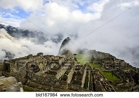 Picture - Aerial view of Macchu Picchu ruins in remote landscape, Cusco, Peru. Fotosearch