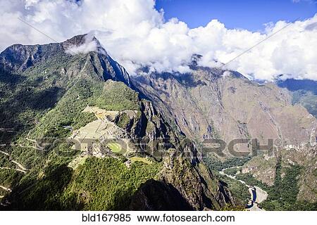 Stock Photography - Aerial view of Macchu Picchu ruins in remote landscape, Cusco, Peru. Fotosearch
