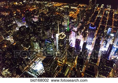 Stock Image - Aerial view of Manhattan cityscape at night, New York, United States. Fotosearch
