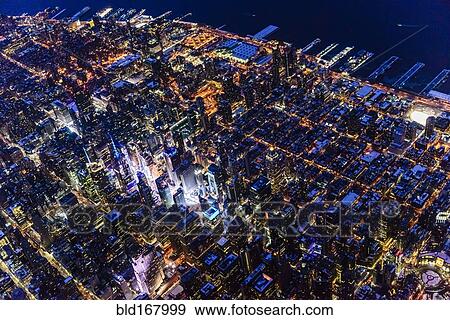 Aerial view of Manhattan cityscape at night, New York, United States View Large Photo Image Stock Photo - Aerial view of Manhattan cityscape at night, New York, United States. Fotosearch