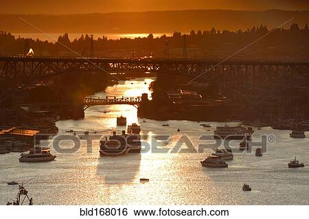 Aerial view of ships on Lake Union at sunset, Seattle, Washington, United States View Large Photo Image Stock Photograph - Aerial view of ships on Lake Union at sunset, Seattle, Washington, United States. Fotosearch