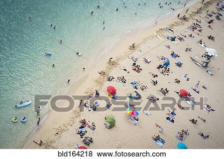 Stock Photo - Aerial view of tourists on beach. Fotosearch