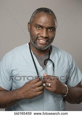 African American doctor holding stethoscope View Large Photo Image Stock Photo - African American doctor holding stethoscope. Fotosearch