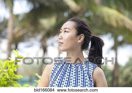 Asian businesswoman smiling outdoors View Large Photo Image Picture - Asian businesswoman smiling outdoors. Fotosearch