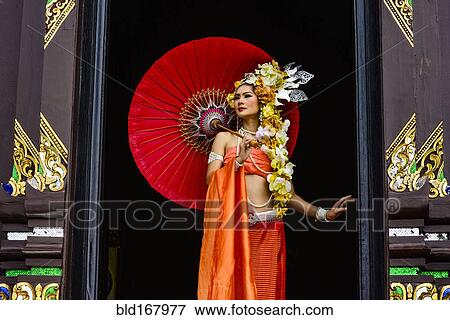 Asian woman standing in ornate temple doorway, Chiang Mai, Chiang Mai, Thailand View Large Photo Image Stock Photo - Asian woman standing in ornate temple doorway, Chiang Mai, Chiang Mai, Thailand. Fotosearch
