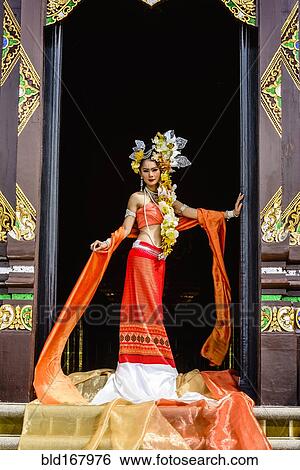 Asian woman standing in ornate temple doorway, Chiang Mai, Chiang Mai, Thailand View Large Photo Image Stock Photograph - Asian woman standing in ornate temple doorway, Chiang Mai, Chiang Mai, Thailand. Fotosearch