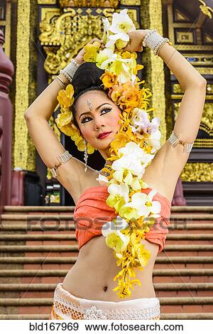 Asian woman standing on stairs of ornate Buddhist temple, Chiang Mai, Chiang Mai, Thailand View Large Photo Image Stock Photo - Asian woman standing on stairs of ornate Buddhist temple, Chiang Mai, Chiang Mai, Thailand. Fotosearch