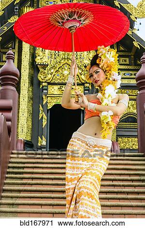 Asian woman with parasol on stairs of ornate Buddhist temple, Chiang Mai, Chiang Mai, Thailand View Large Photo Image Stock Image - Asian woman with parasol on stairs of ornate Buddhist temple, Chiang Mai, Chiang Mai, Thailand. Fotosearch