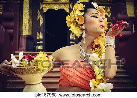 Asian woman with petals on stairs of ornate Buddhist temple, Chiang Mai, Chiang Mai, Thailand View Large Photo Image Stock Photo - Asian woman with petals on stairs of ornate Buddhist temple, Chiang Mai, Chiang Mai, Thailand. Fotosearch