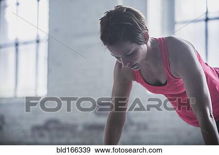 Stock Photo - Athlete doing push-ups. Fotosearch
