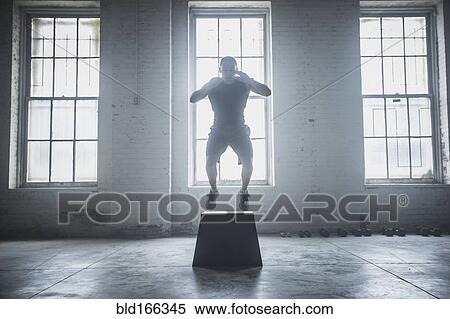 Stock Photography - Athlete jumping on platform. Fotosearch