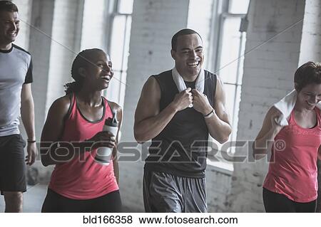Stock Photo - Athletes talking in gym. Fotosearch