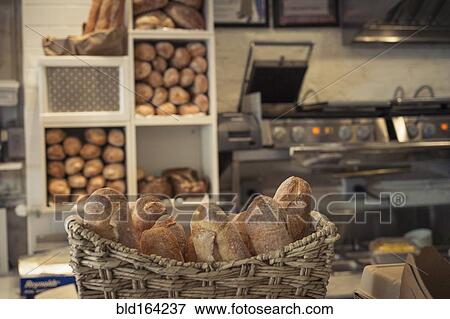 Baguettes in basket on bakery counter View Large Photo Image Stock Photo - Baguettes in basket on bakery counter. Fotosearch