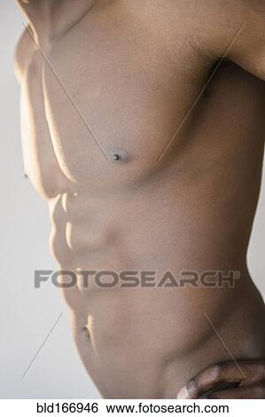 Black man flexing abdominal muscles View Large Photo Image Stock Photograph - Black man flexing abdominal muscles. Fotosearch