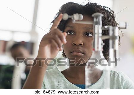 Black student doing experiment in science lab View Large Photo Image Stock Photo - Black student doing experiment in science lab. Fotosearch