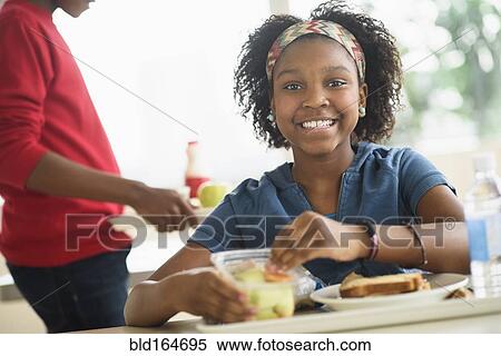 Black students eating lunch in school cafeteria View Large Photo Image Stock Photography - Black students eating lunch in school cafeteria. Fotosearch