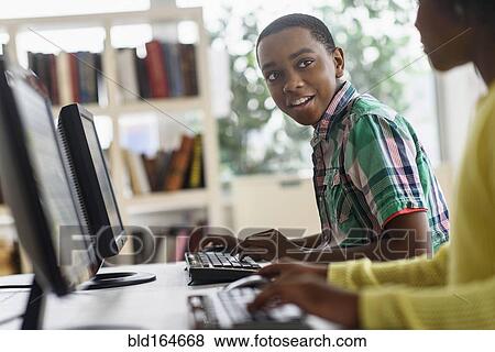 Black students using computers in classroom View Large Photo Image Stock Photo - Black students using computers in classroom. Fotosearch