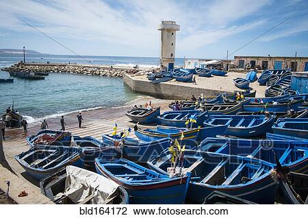 Blue boats docked on boat ramp View Large Photo Image Stock Image - Blue boats docked on boat ramp. Fotosearch