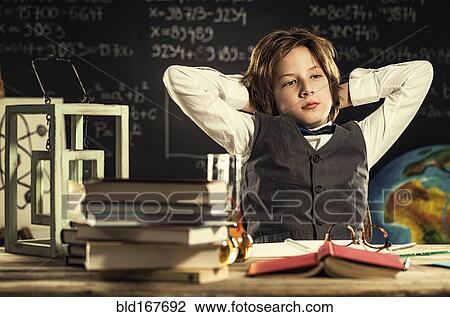 Bored student sitting at desk in classroom View Large Photo Image Stock Image - Bored student sitting at desk in classroom. Fotosearch