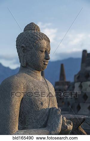 Buddha statue on Temple of Borobudur, Borobudur, Indonesia View Large Photo Image Stock Image - Buddha statue on Temple of Borobudur, Borobudur, Indonesia. Fotosearch