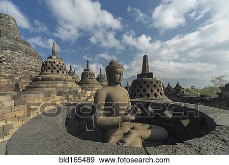 Stock Photo - Buddha statue on Temple of Borobudur, Borobudur, Indonesia. Fotosearch