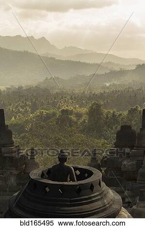 Stock Photography - Buddha statue on Temple of Borobudur, Borobudur, Indonesia. Fotosearch