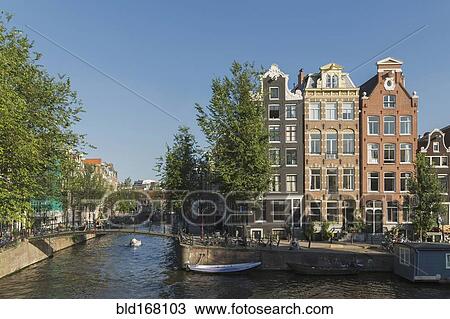 Stock Image - Buildings along Amsterdam canal, Netherland. Fotosearch