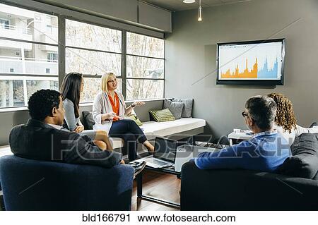Business people having meeting in office lounge View Large Photo Image Stock Image - Business people having meeting in office lounge. Fotosearch