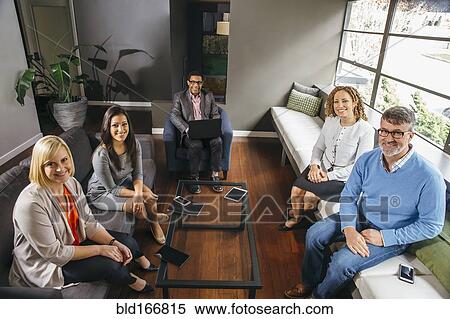 Business people sitting in office meeting View Large Photo Image Stock Photography - Business people sitting in office meeting. Fotosearch