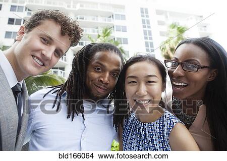 Business people smiling outdoors View Large Photo Image Picture - Business people smiling outdoors. Fotosearch
