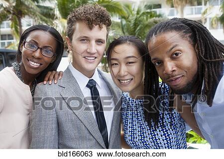 Stock Image - Business people smiling outdoors. Fotosearch