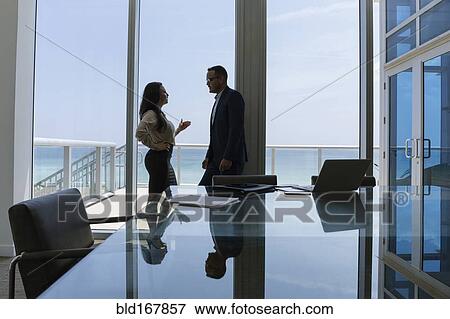 Business people talking in conference room View Large Photo Image Stock Photo - Business people talking in conference room. Fotosearch