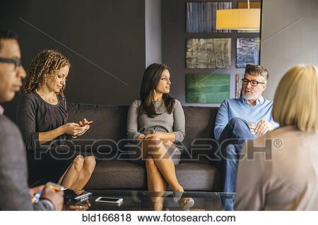 Business people talking in office meeting View Large Photo Image Stock Photo - Business people talking in office meeting. Fotosearch