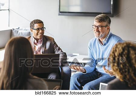 Business people talking in office meeting View Large Photo Image Stock Photography - Business people talking in office meeting. Fotosearch