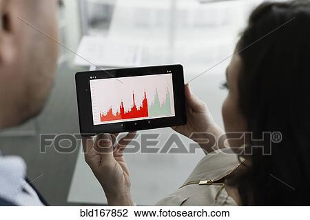 Business people viewing graph on digital tablet View Large Photo Image Stock Image - Business people viewing graph on digital tablet. Fotosearch