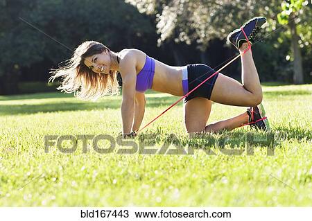 Caucasian athlete exercising in park View Large Photo Image Stock Image - Caucasian athlete exercising in park. Fotosearch