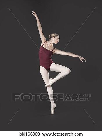 Caucasian ballet dancer posing on pointe View Large Photo Image Stock Image - Caucasian ballet dancer posing on pointe. Fotosearch