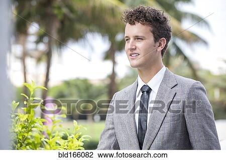 Caucasian businessman standing outdoors View Large Photo Image Stock Image - Caucasian businessman standing outdoors. Fotosearch