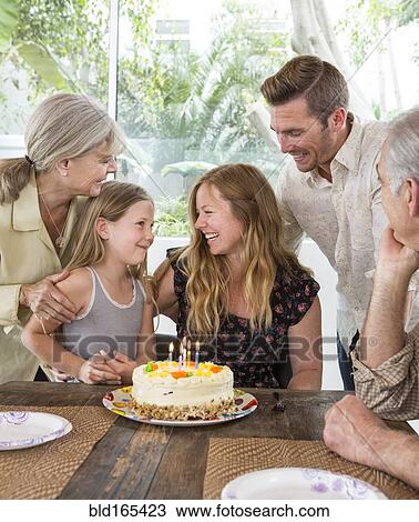 Caucasian family celebrating birthday at table View Large Photo Image Stock Image - Caucasian family celebrating birthday at table. Fotosearch