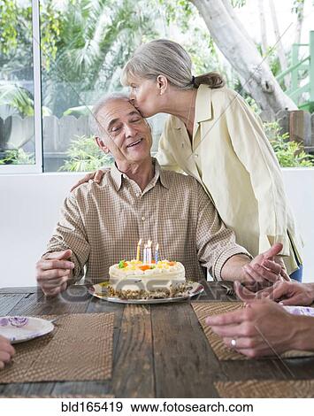 Caucasian family celebrating birthday at table View Large Photo Image Stock Photo - Caucasian family celebrating birthday at table. Fotosearch
