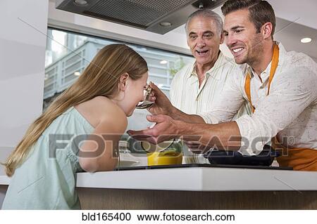Caucasian father, daughter and grandfather cooking in kitchen View Large Photo Image Stock Image - Caucasian father, daughter and grandfather cooking in kitchen. Fotosearch
