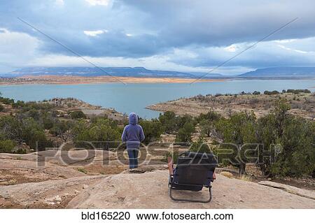 Caucasian girl admiring scenic view from hilltop View Large Photo Image Stock Image - Caucasian girl admiring scenic view from hilltop. Fotosearch
