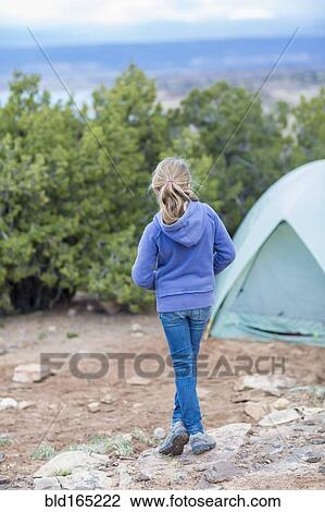 Caucasian girl standing at campsite in desert View Large Photo Image Stock Image - Caucasian girl standing at campsite in desert. Fotosearch