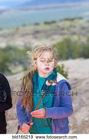 Caucasian girl toasting marshmallows at campfire View Large Photo Image Stock Photo - Caucasian girl toasting marshmallows at campfire. Fotosearch
