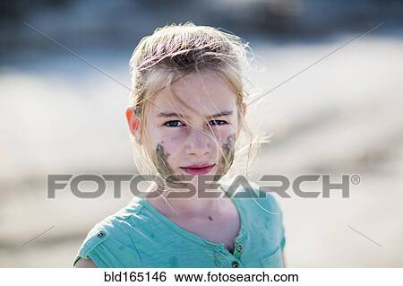 Caucasian girl with messy face on beach View Large Photo Image Stock Photograph - Caucasian girl with messy face on beach. Fotosearch