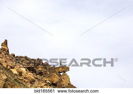 Caucasian hiker standing on sheer cliff boulder, Smith Rock State Park, Oregon, United States View Large Photo Image Stock Image - Caucasian hiker standing on sheer cliff boulder, Smith Rock State Park, Oregon, United States. Fotosearch