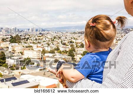 Stock Image - Caucasian mother and daughter admiring San Francisco cityscape, California, United States. Fotosearch